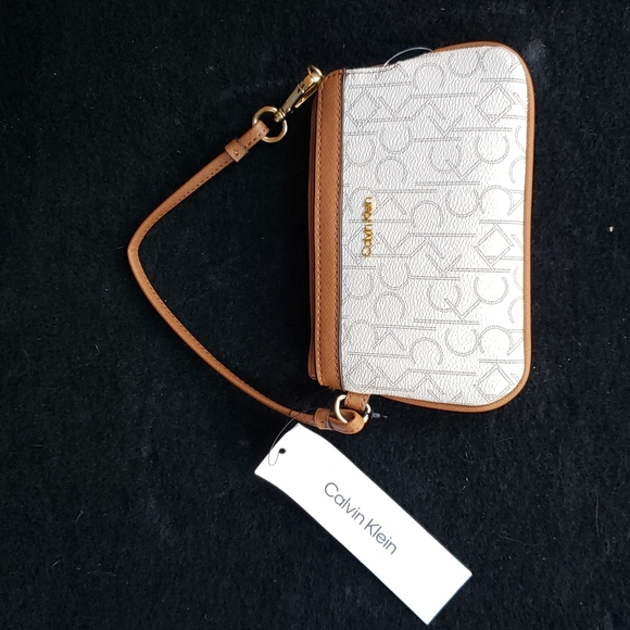 Calvin Klein Handbags - Calvin Klein clutch/ wallet with strap